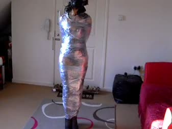 Dani Mummified And Gas Mask Hell - Dani mummified and gas mask hell. 

this is my new model dani,in this clip she is wrapped from head to toe in cling film while wearing a gas mask. She struggles and beg me to let her go but for a while let her try to get free,now and then giving her a spank with my crop and having fun covering her breathing hole. Hope you like.