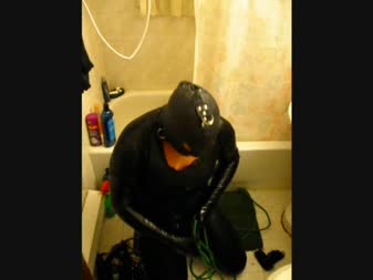 Self Bound Urine Feed - Vanessa ties herself up, including hood, blindfold and o-ring harness gag... With a funnel in it... Pulls a cord... And a container of pee flows out of a tube and onto her and into the funnel!